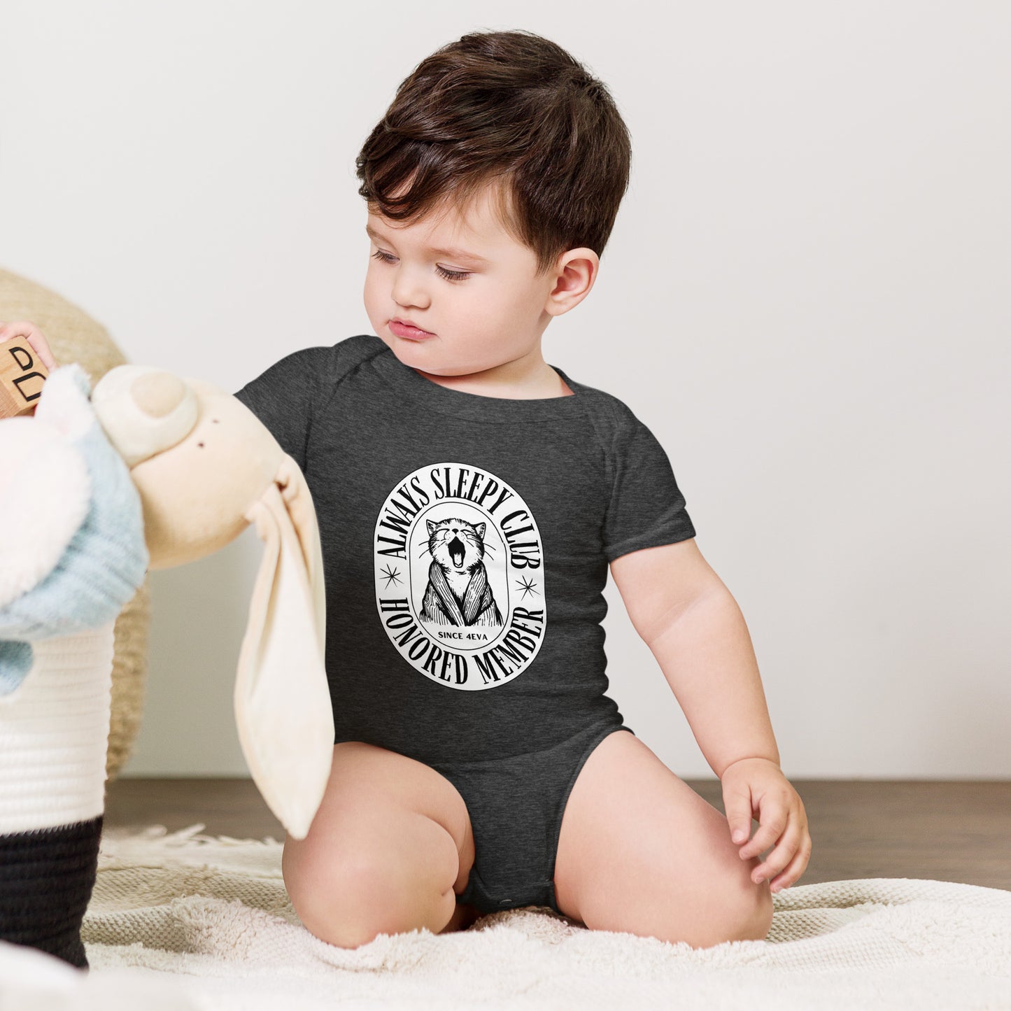 baby onesie with 'Always Sleepy Club Honored Member' yawning cat design