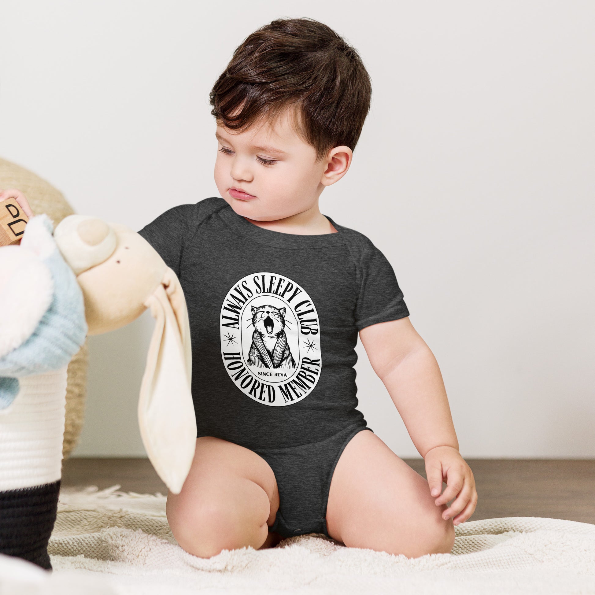 baby onesie with 'Always Sleepy Club Honored Member' yawning cat design