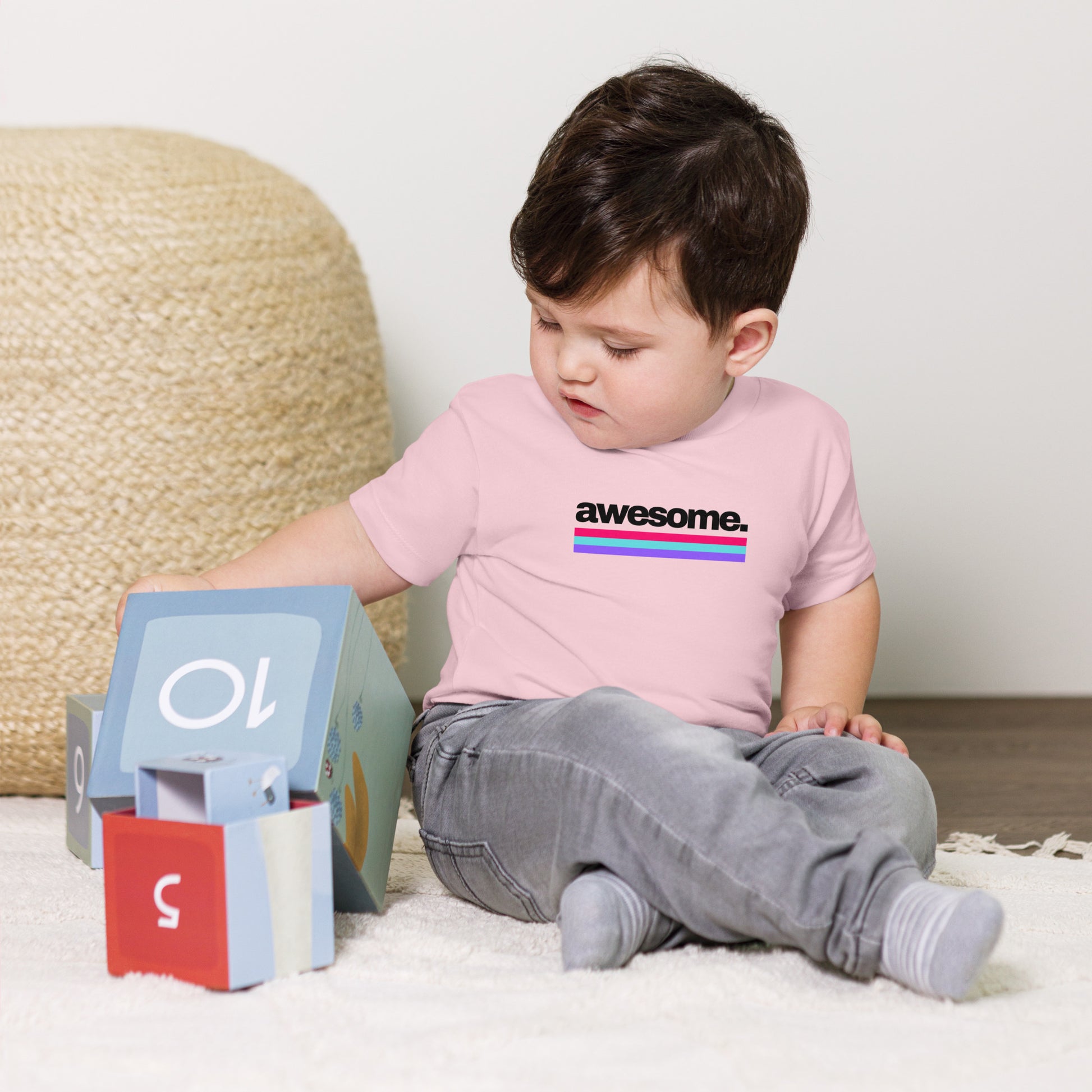 baby t-shirt with 'awesome.' text and colorful lines design