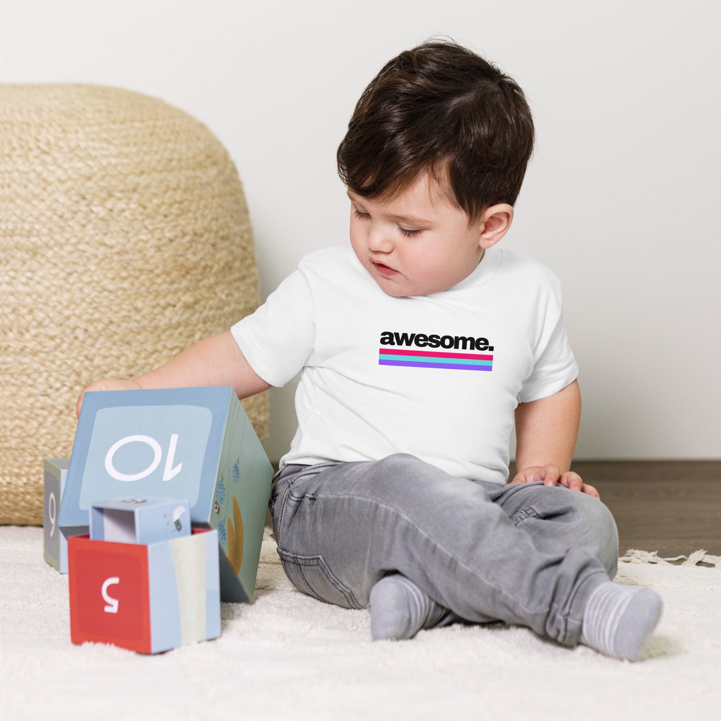 baby t-shirt with 'awesome.' text and colorful lines design