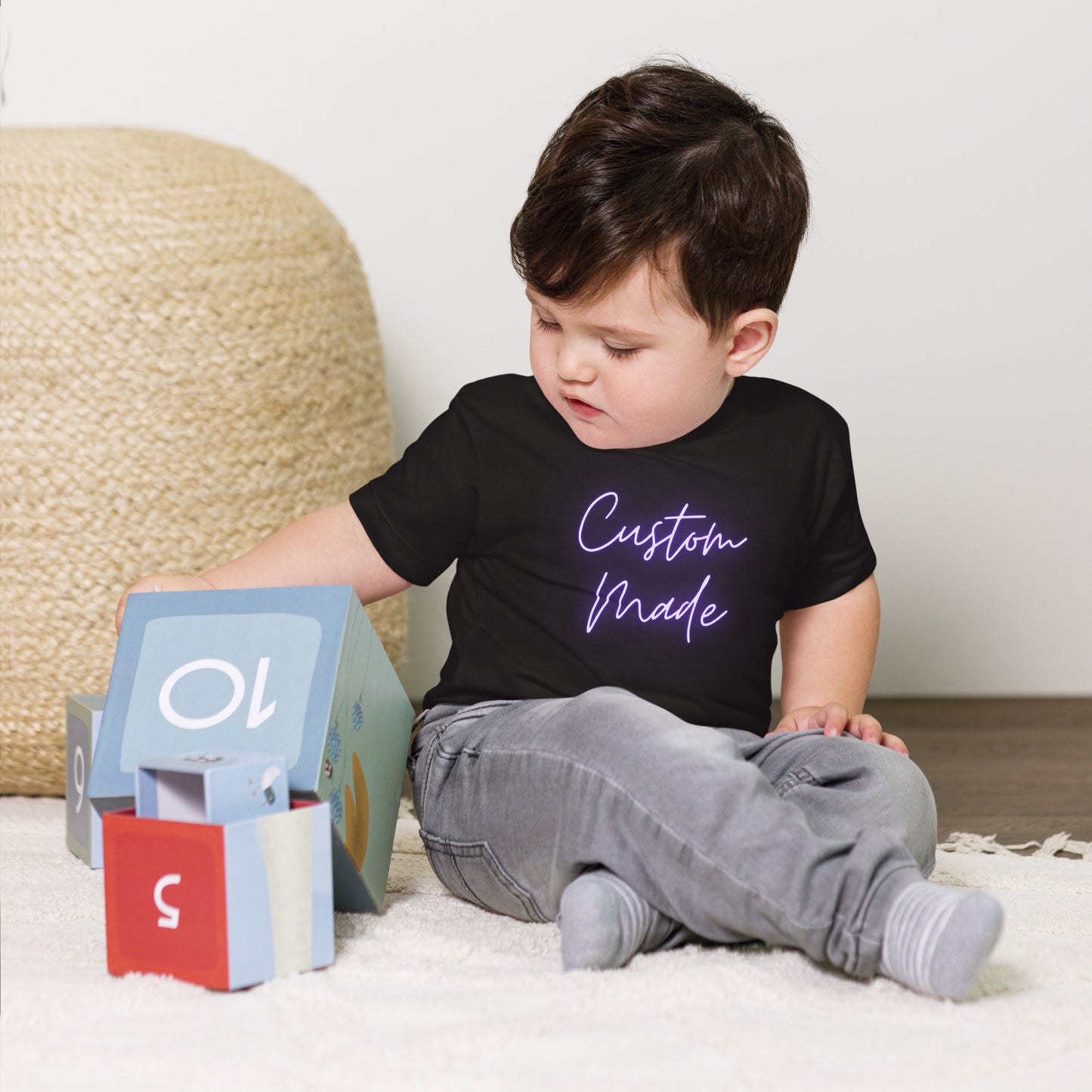 baby t-shirt with 'Custom Made' neon text design