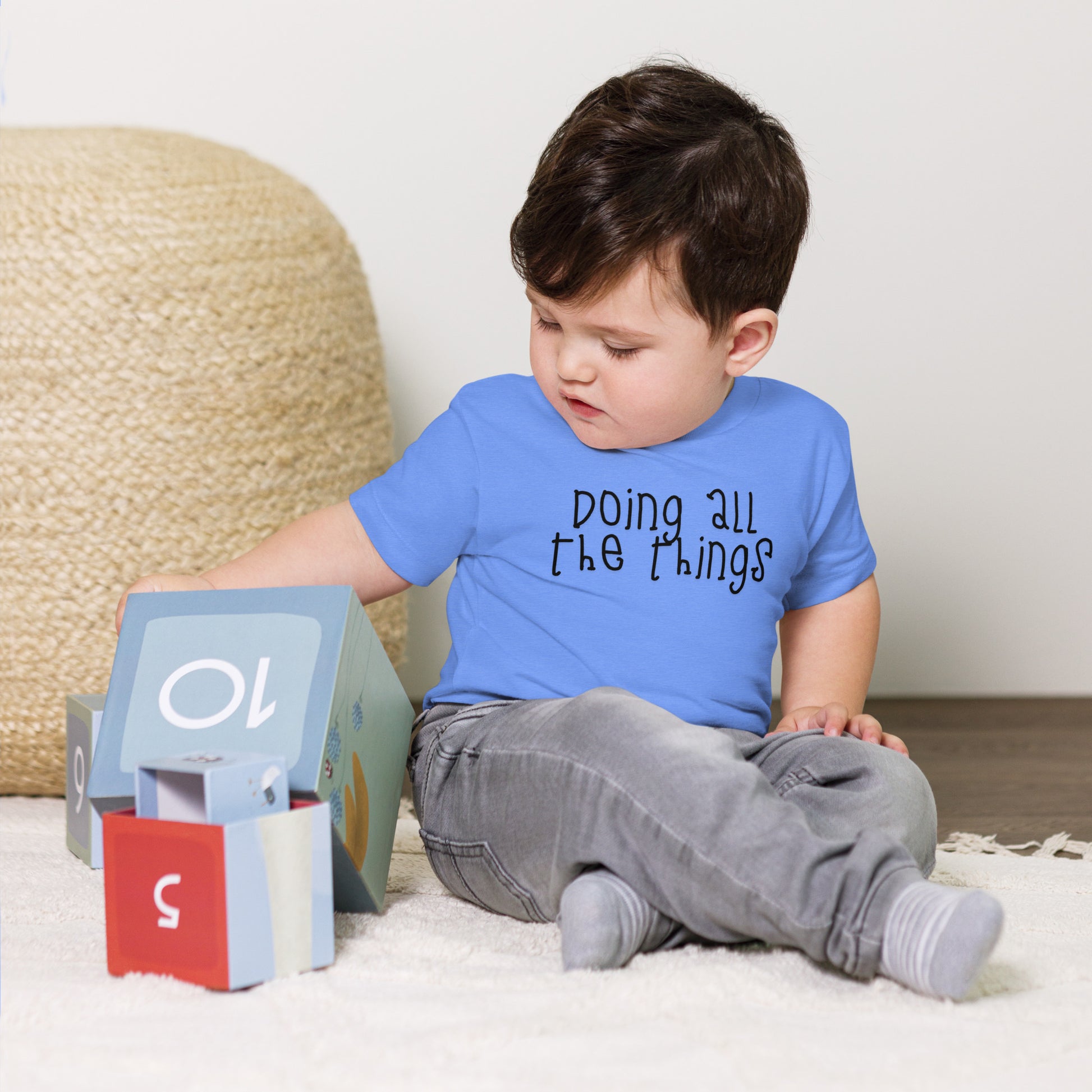 toddler t-shirt with 'Doing All the Things' text in child-like handwritten style