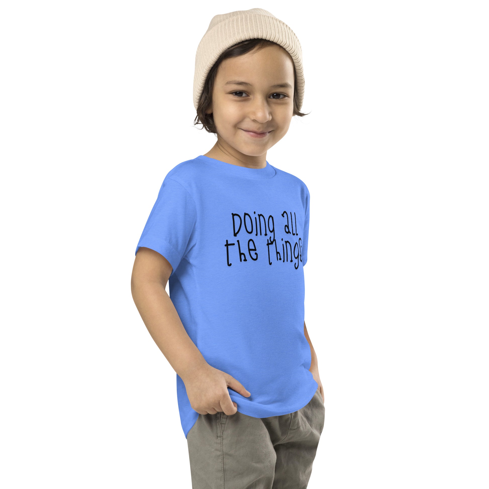 toddler t-shirt with 'Doing All the Things' text in child-like handwritten style