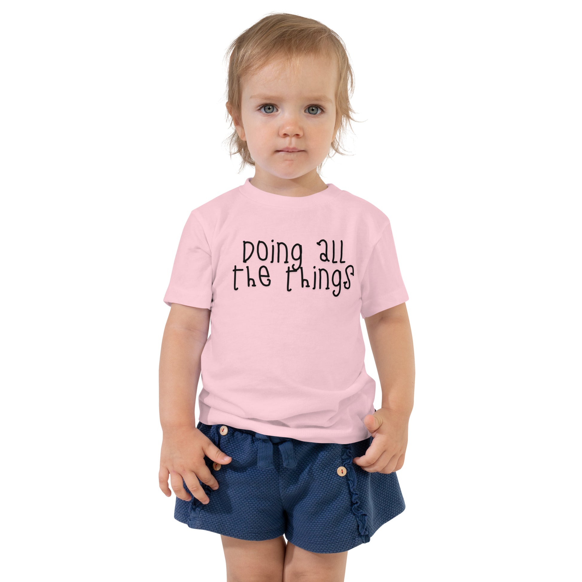 toddler t-shirt with 'Doing All the Things' text in child-like handwritten style