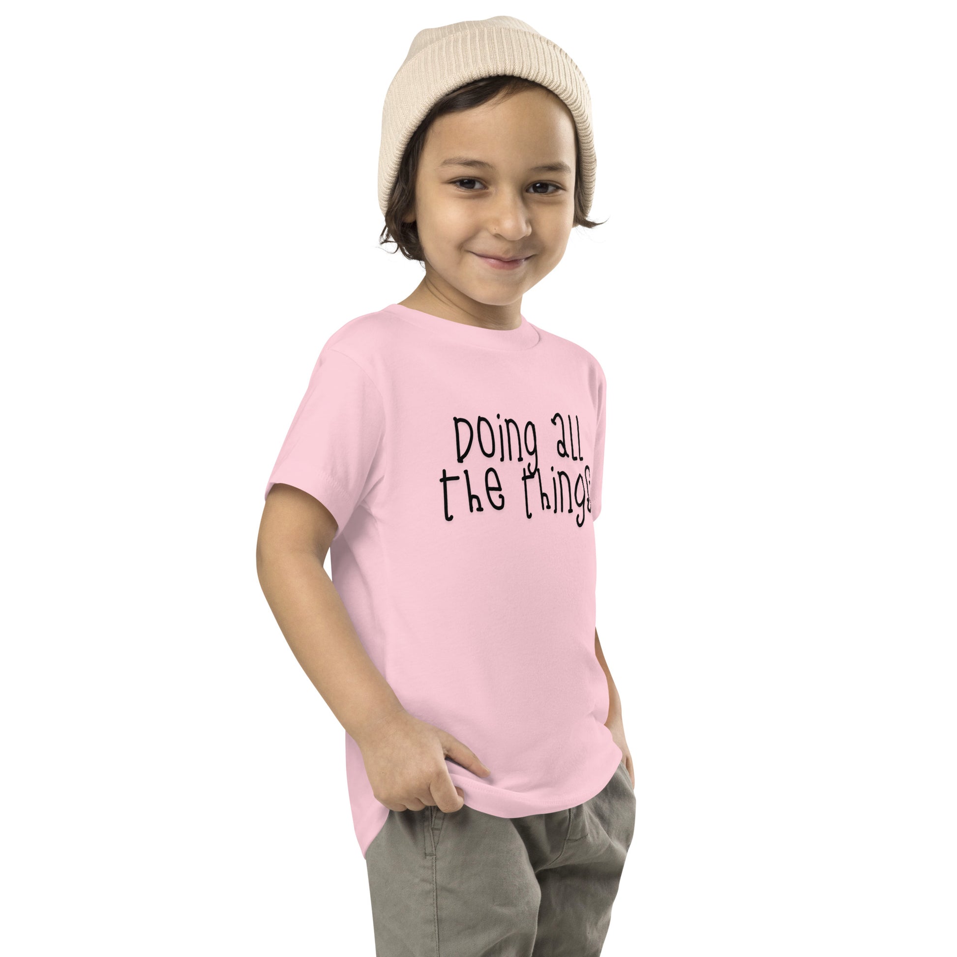toddler t-shirt with 'Doing All the Things' text in child-like handwritten style