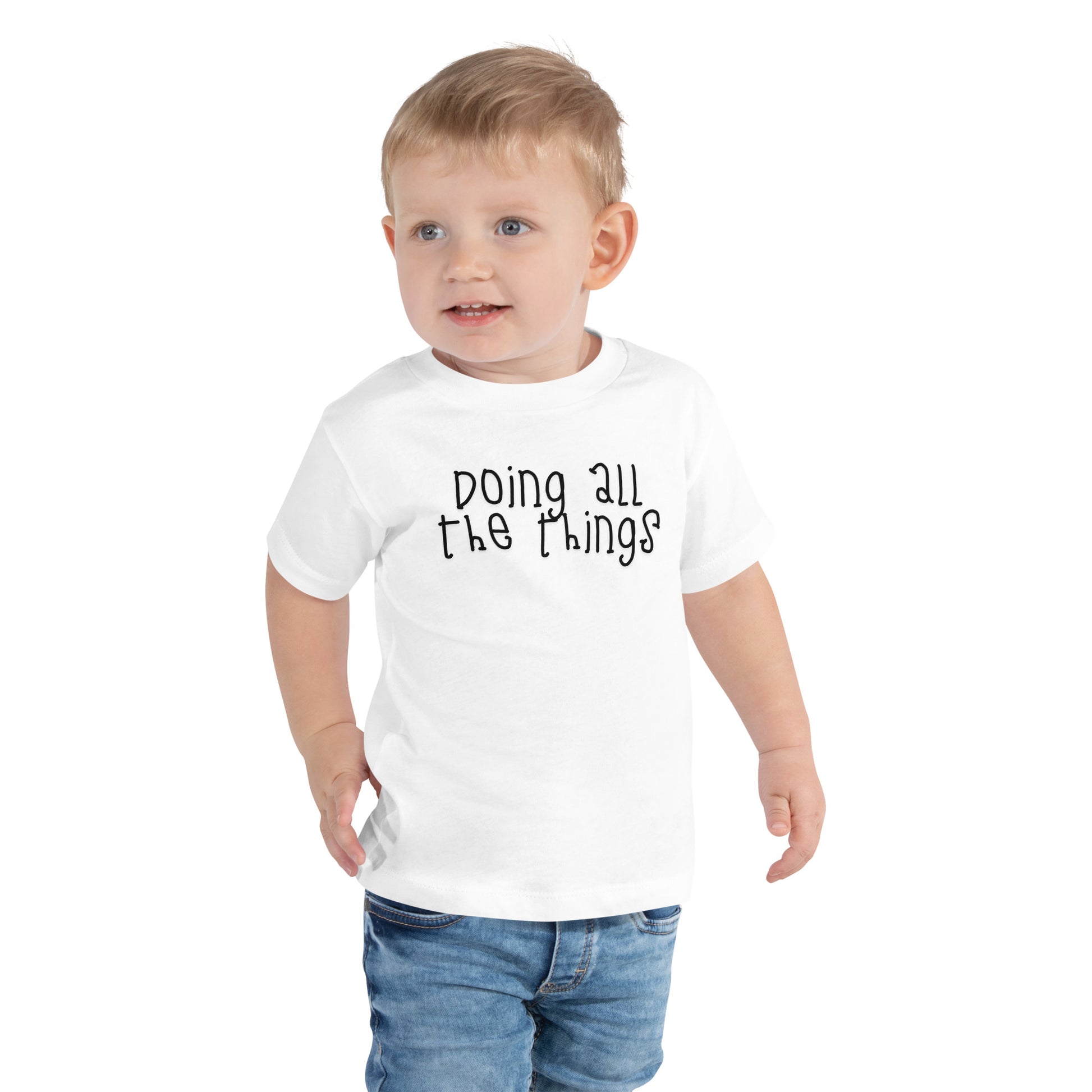 toddler t-shirt with 'Doing All the Things' text in child-like handwritten style