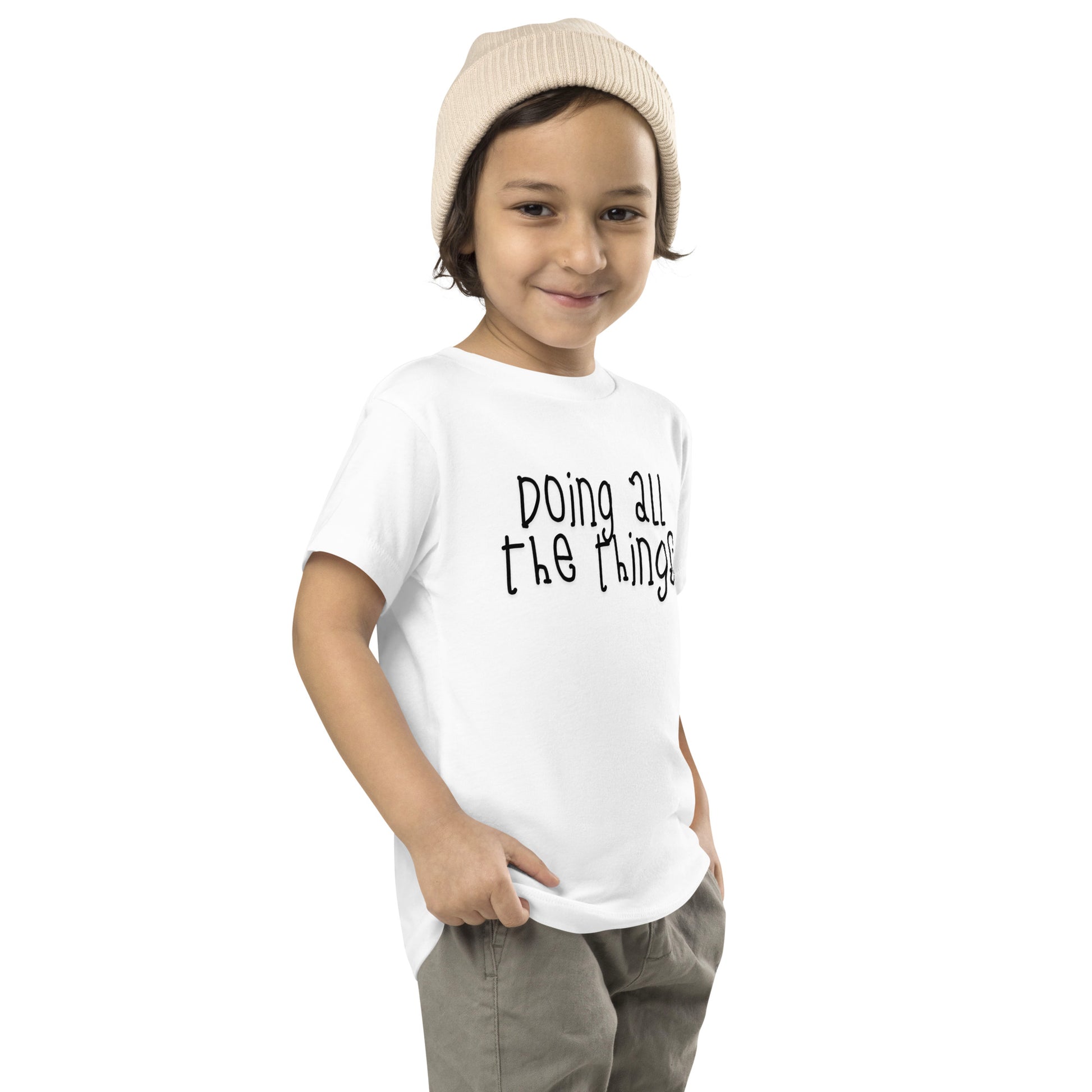 toddler t-shirt with 'Doing All the Things' text in child-like handwritten style