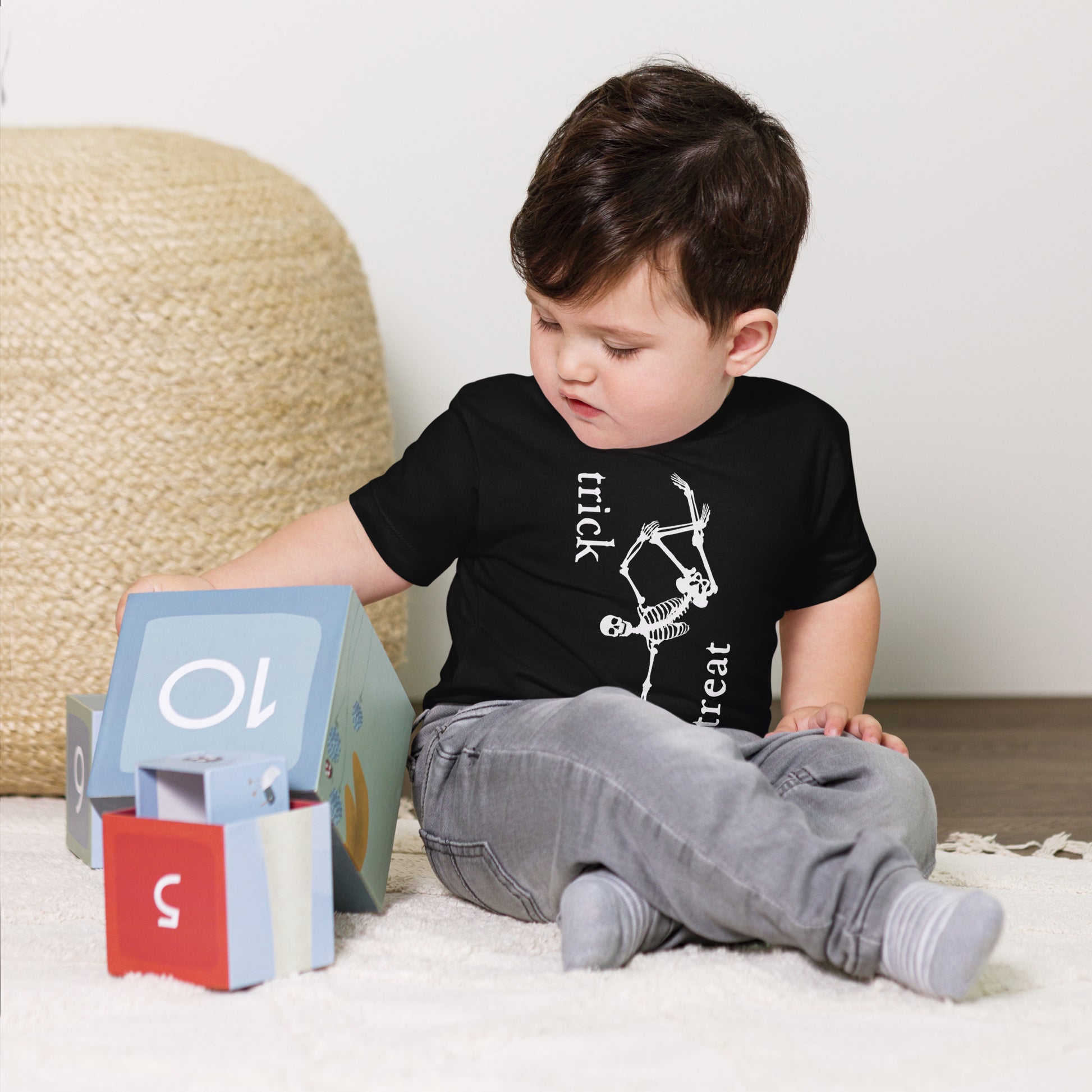 toddler t-shirt with skeleton and 'trick treat' text design
