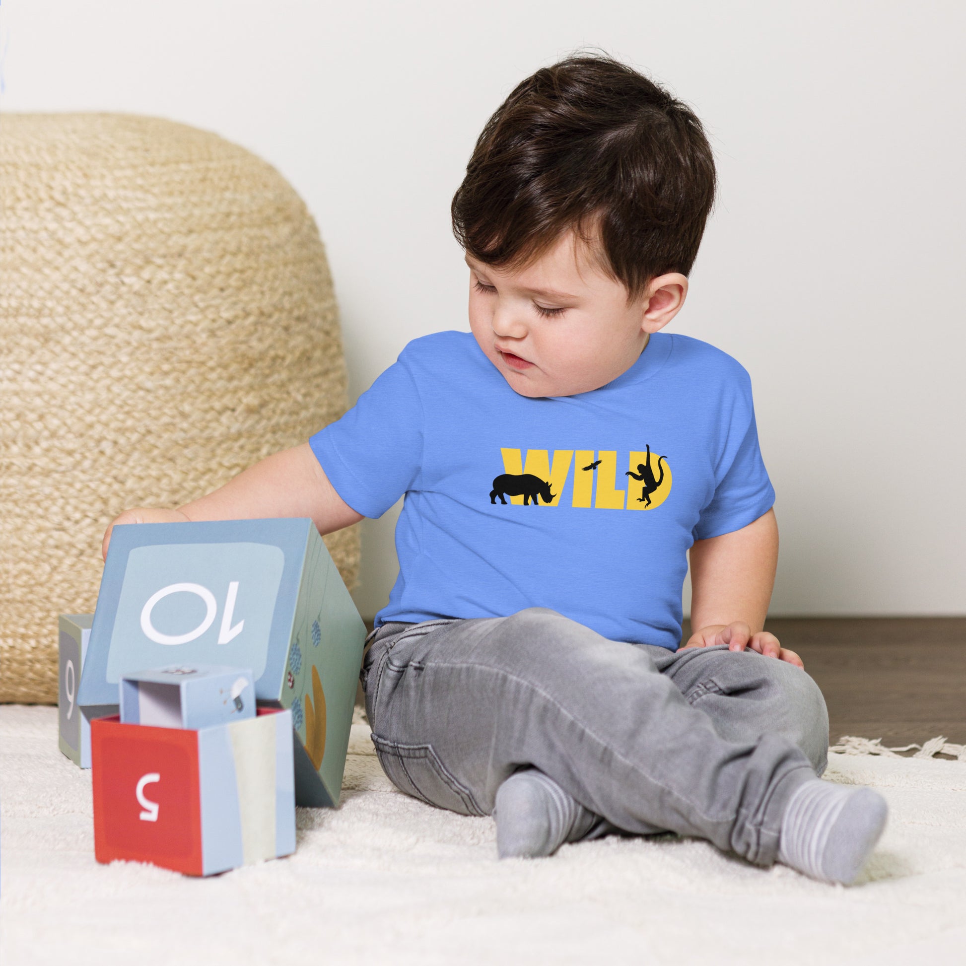 toddler t-shirt with 'Wild' text and animal silhouettes design
