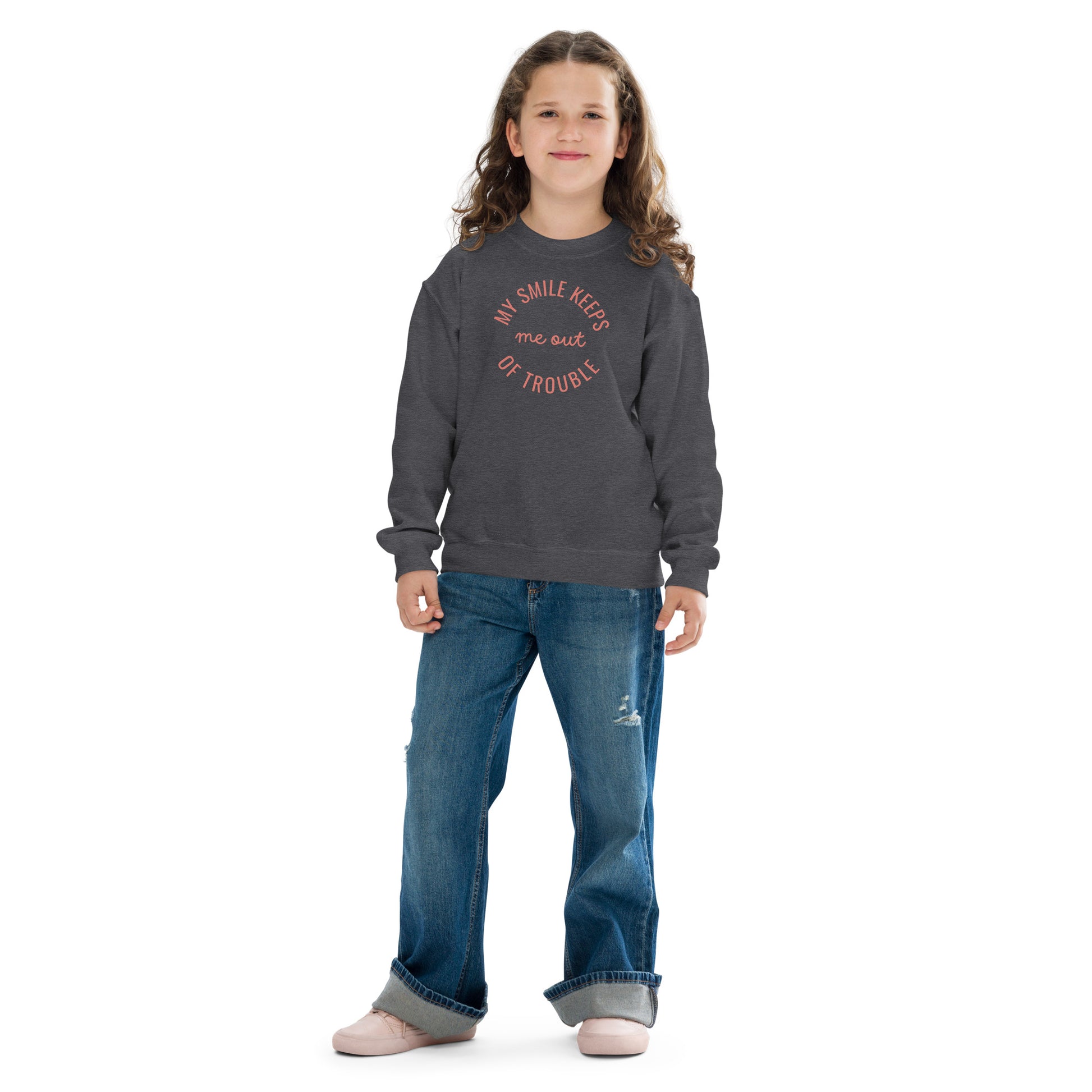 youth crew neck sweatshirt with 'My Smile Keeps Me Out of Trouble' text design