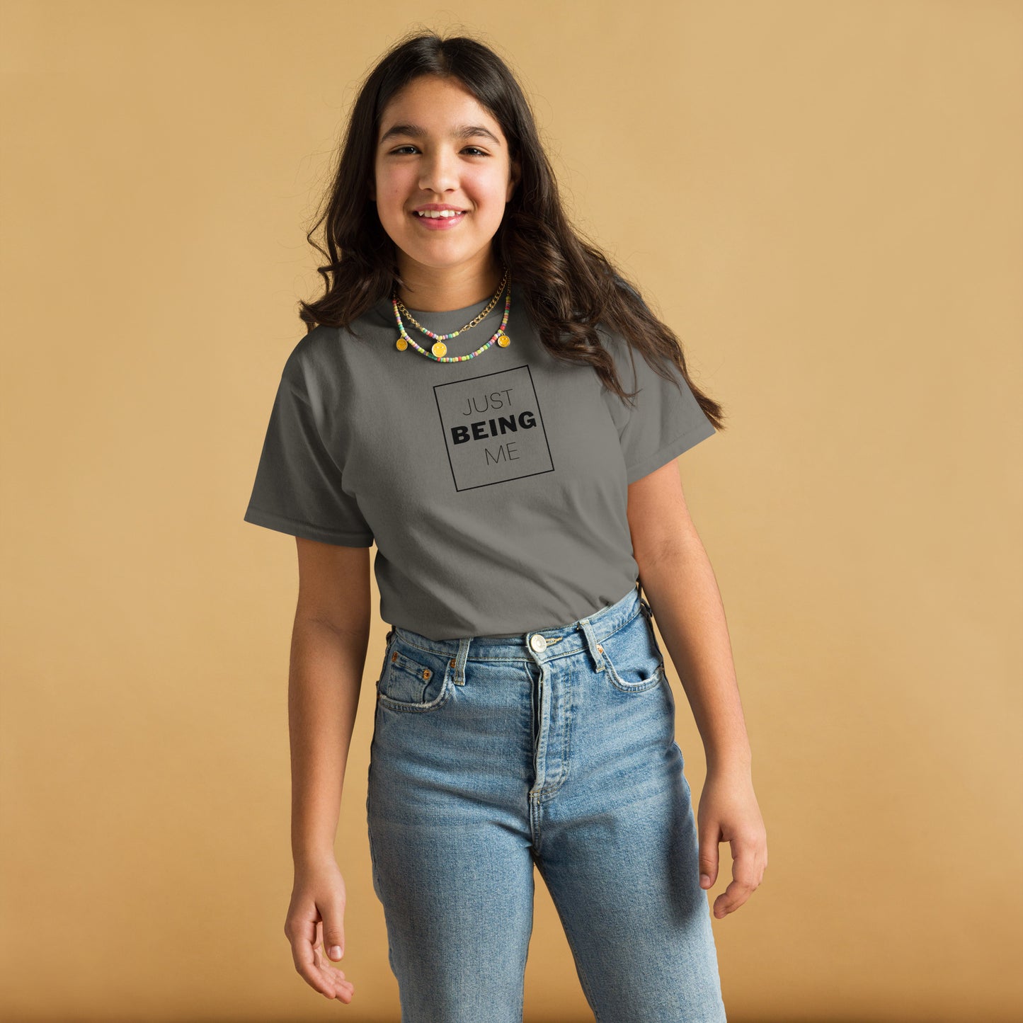 youth t-shirt with 'Just Being Me' text design in bright colors