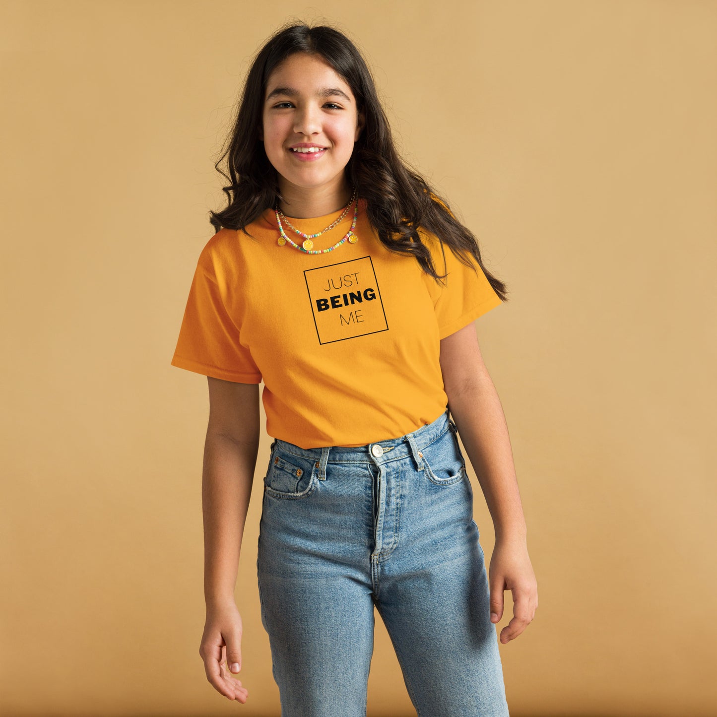 youth t-shirt with 'Just Being Me' text design in bright colors