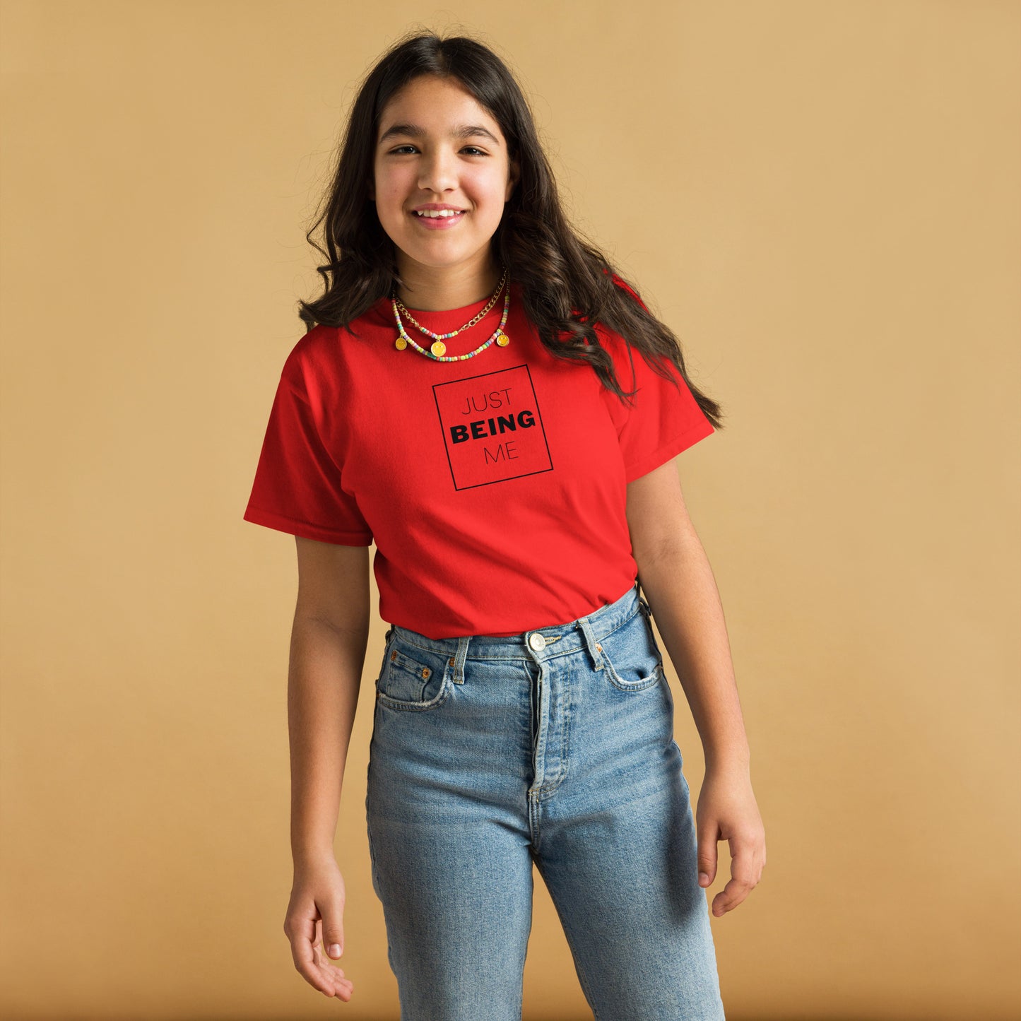 youth t-shirt with 'Just Being Me' text design in bright colors