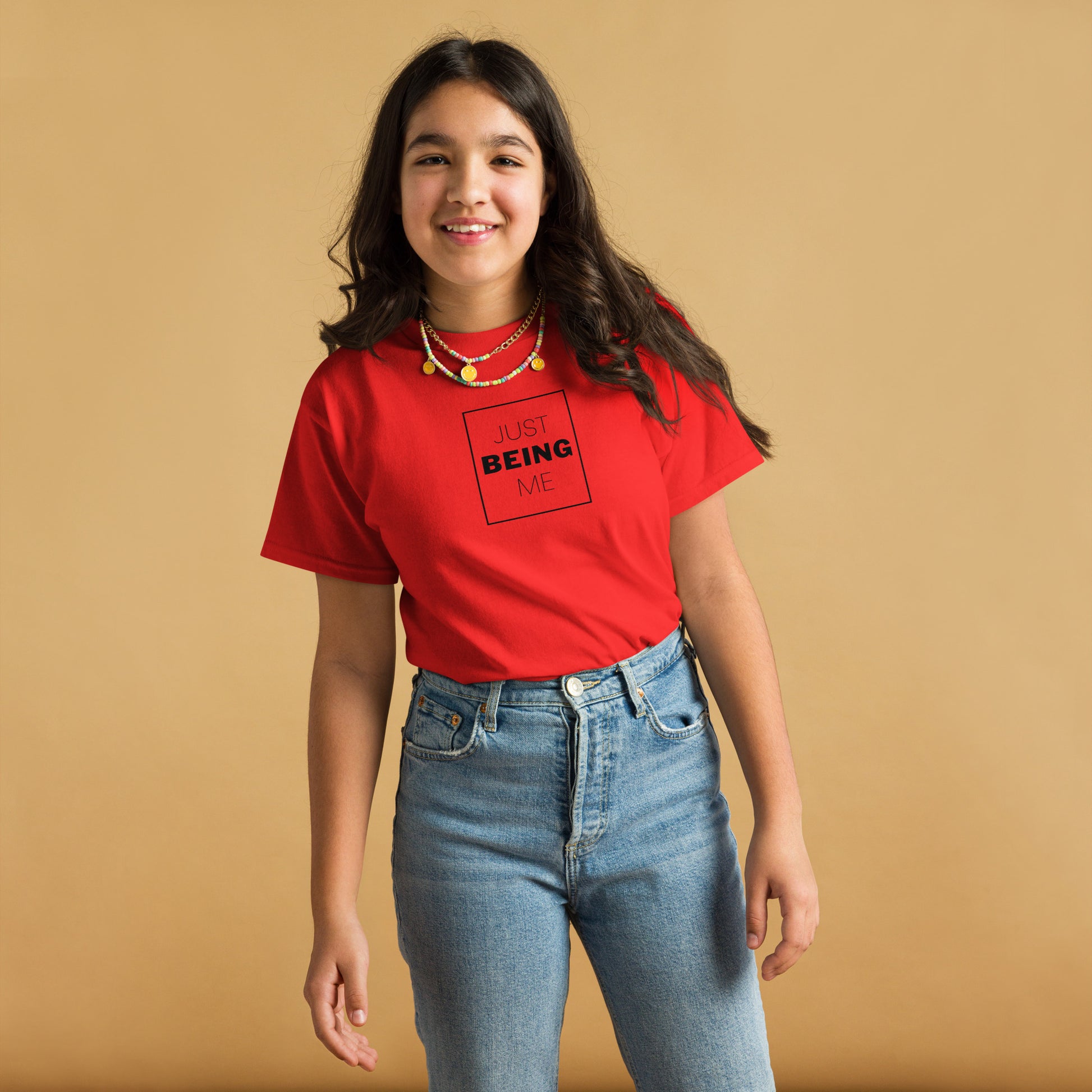 youth t-shirt with 'Just Being Me' text design in bright colors