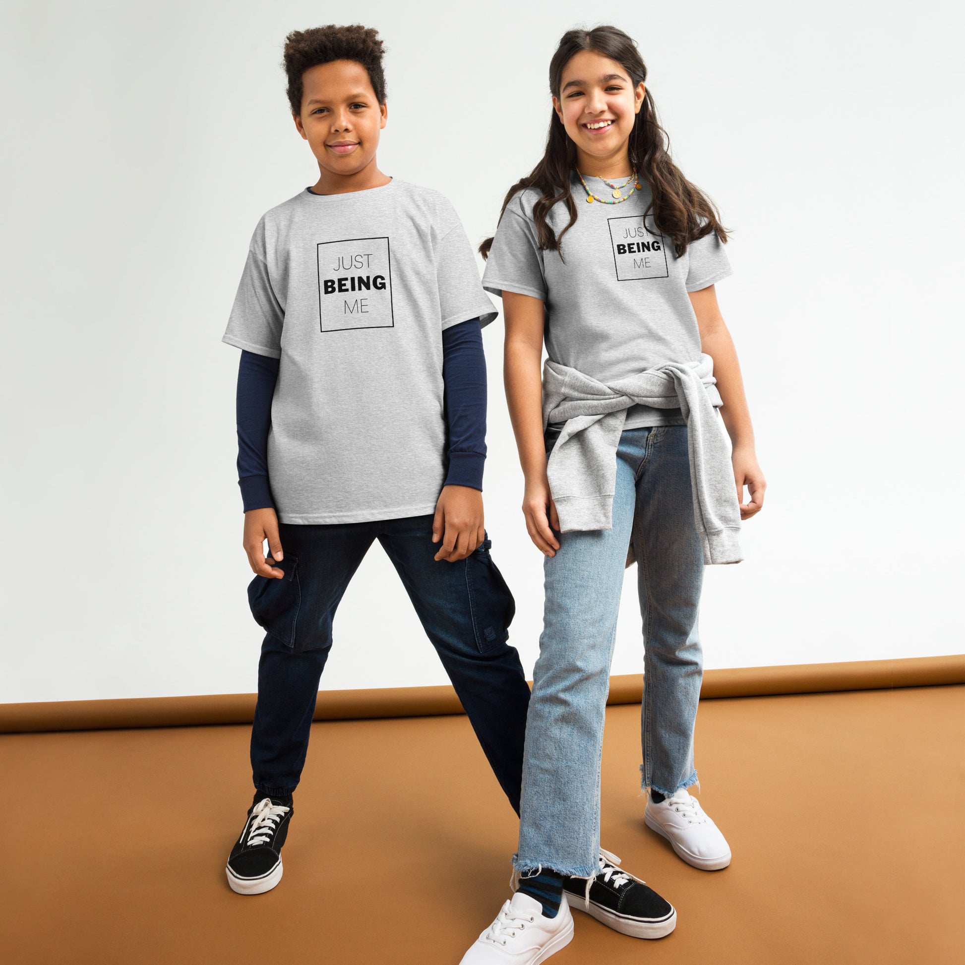 youth t-shirt with 'Just Being Me' text design in bright colors