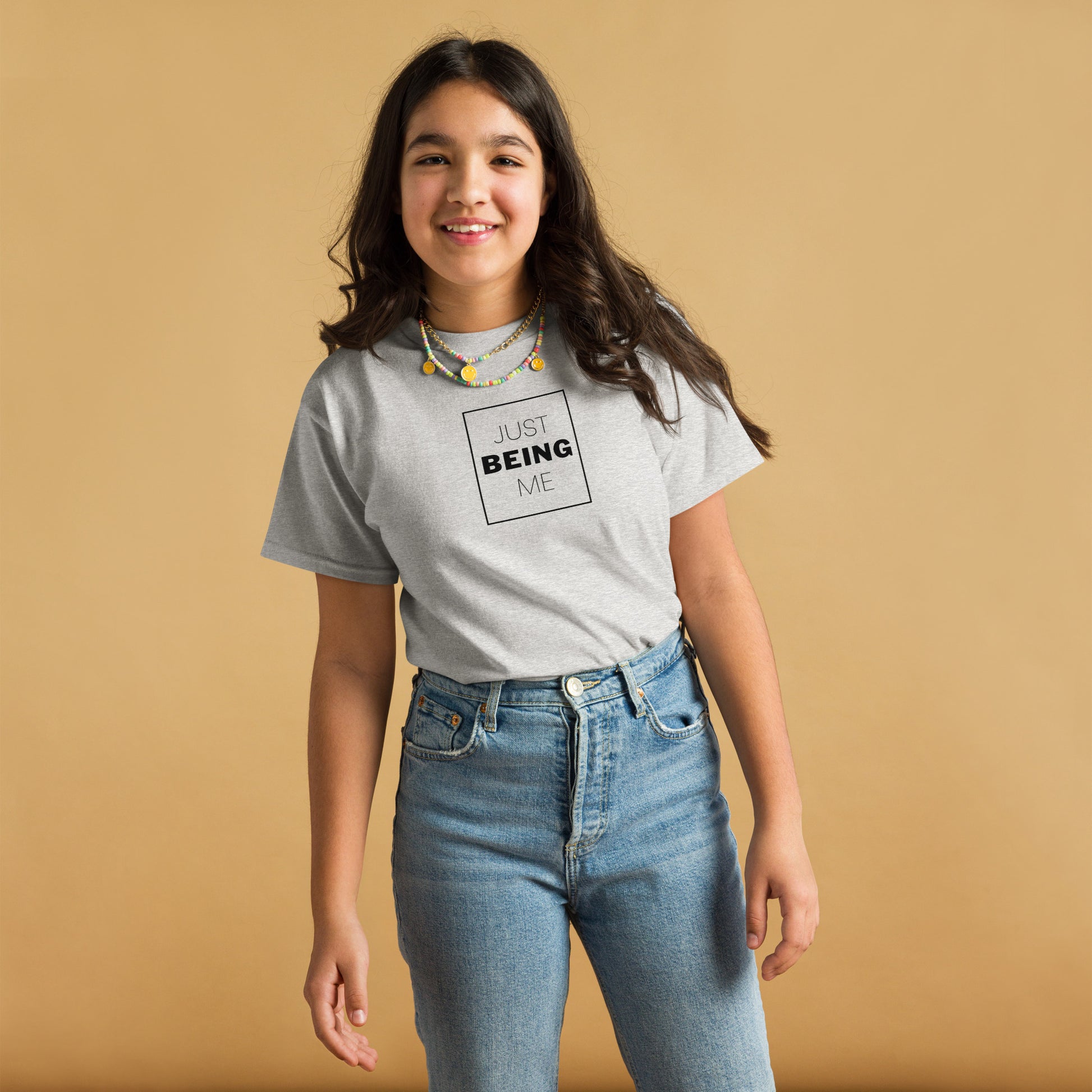 youth t-shirt with 'Just Being Me' text design in bright colors