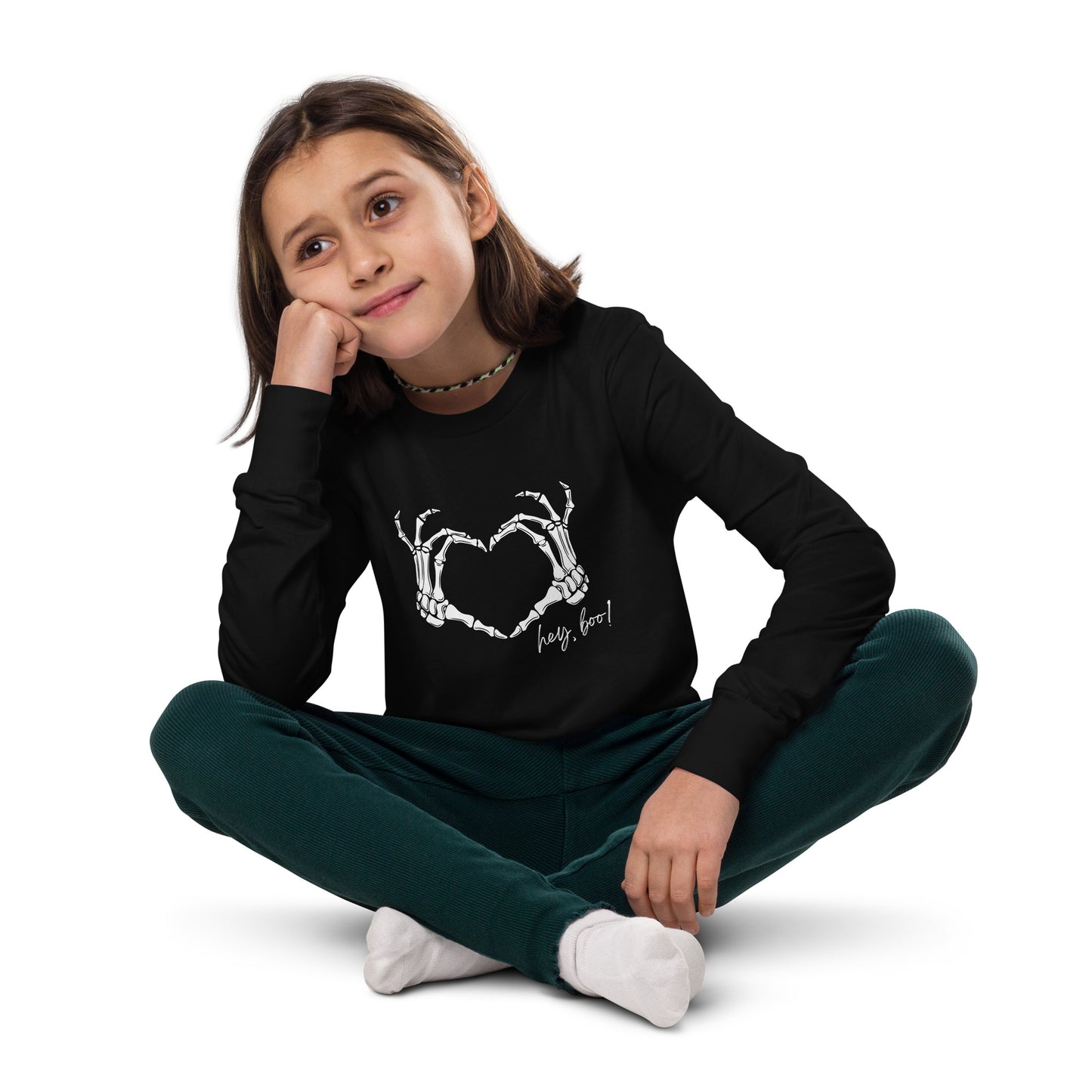 youth long sleeve t-shirt with skeleton hands heart graphic and 'Hey Boo!' text